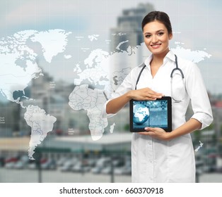 Travel Nursing Concept. Yong Doctor Holding Tablet On Cityscape Background