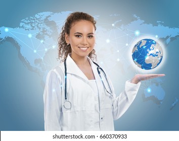 Travel Nursing Concept. Yong Doctor Holding Globe And World Map On Background