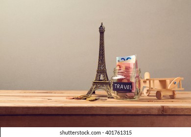 Travel To Paris, France Concept With Eiffel Tower Souvenir And Wooden Airplane Toy. Planning Summer Vacation, Money Budget Trip Concept.