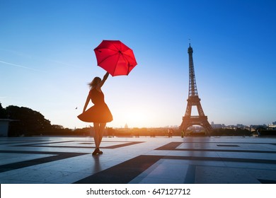 Travel To Paris, Silhouette Of Beautiful Girl With Red Umbrella Near Eiffel Tower