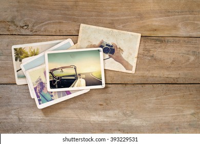 Travel Photo Album Of Remembrance And Nostalgia On Wood Table. Instant Photo Of Film Camera - Vintage And Retro Style