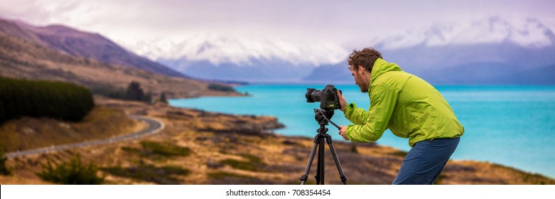 Travel Photographer Man Taking Nature Video Of Mountain Landscape At Peter's Lookout, New Zealand Banner. Hiker Tourist Professional Videographer On Adventure Vacation Shooting Slr Camera On Tripod.