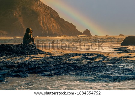 Travel Photographer taking landscape photo of ocean view 