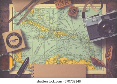 travel and photography inspired background/mock-up with various items on an antique map, vintage effect