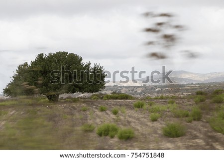 Travel photography. Photo from the window of a moving car. Cyprus. Usual life. Cars. Mountain road.