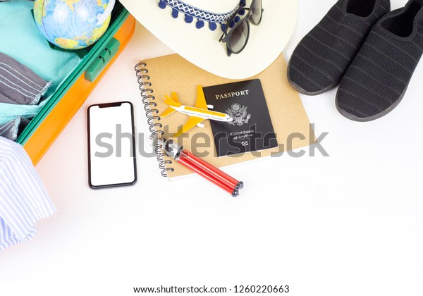 Travel plan, trip vacation accessories for trip,\
tourism mockup - Outfit of traveler on white background. Flat lay\
and copyspace. - Image