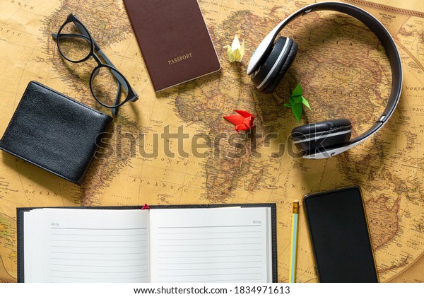 Travel plan, trip vacation accessories for\
trip, tourism mockup - Outfit of traveler on wooden background.\
Flat lay and copyspace.