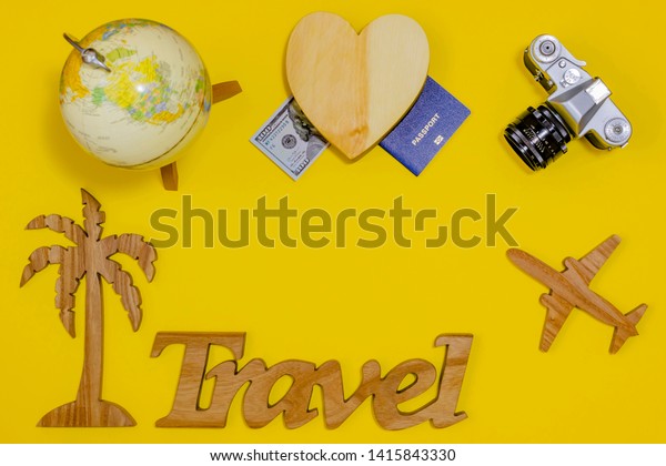 Travel planning concept. Items on a yellow\
background. Сopy space.