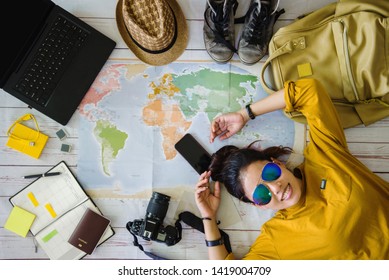 Travel Planning Concept With Map. Overhead View Of Equipment For Travelers. Background Travel Ideas Young Women Sleeping Smiling On The Map. Concept On Vacation Trip, Map, Travel Thailand.