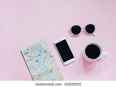 Travel Planning Concept : Map, Smartphone, Sunglasses And Hot Coffee Cup On Pink Background, Top View With Minimal Style