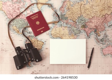 Travel Planning - Map With Passport, Notepad, Pen And Binoculars