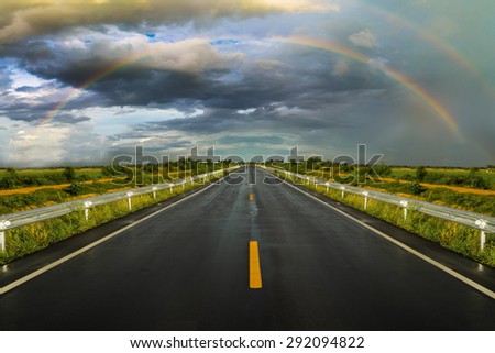  travel road asphalt  to the rainbow and rain cloud 
