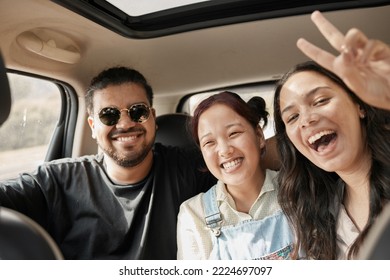 Travel, road trip and car with people or friends portrait excited for journey, holiday or vacation together. Gen z group of people with peace sign driving for safety, transportation and adventure