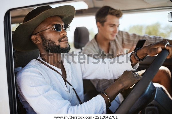 Travel, road trip and men driving with smartphone\
for online guide or direction in countryside holiday, journey and a\
vacation summer. Black man, friends or couple drive in car or van\
with 5g network