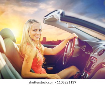 travel, road trip and people concept - happy young woman driving convertible car - Shutterstock ID 1103221139