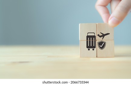 Travel Safety And Travel Insurance Concept ;wooden Cube With Grey Background, Copy Space. Intended To Cover Medical Expenses, Trip Cancellation, Lost Luggage And Other Losses Incurred While Traveling.