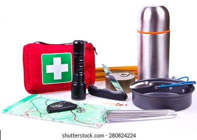 Travel set. Tourist outfit for camping or hiking. Various professional tools and items for outdoors pastime on white background, partly isolated with shadows. Place for your text.