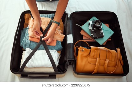 Travel suitcase, bedroom and hands of woman packing for Europe holiday, vacation or adventure tourist journey. Hospitality, hotel bed and photographer with luggage bag, clothes and camera in Madrid - Powered by Shutterstock