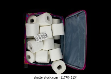 Lady´s Travel Suitcase Full Of Toilet Paper And Medicaments.White Toilet Paper In A Travel Suitcase With Dots.Intestinal Problems, Abdominal Pain, Diarrhea On Vacation.