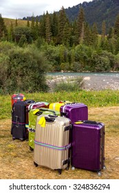 Travel Suitcases In Wilderness Area Heap Of Business Style Bags Dropped In Inappropriate Outdoor Uncivilized Landscape