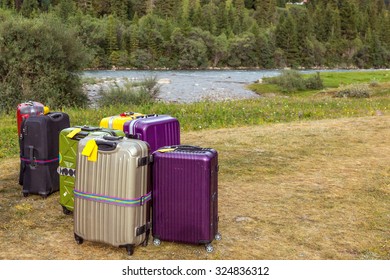 Travel Suitcases In Wilderness Area Heap Of Business Style Bags Dropped In Inappropriate Outdoor Uncivilized Landscape