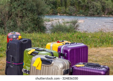 Travel Suitcases In Wilderness Area Heap Of Business Style Bags Dropped In Inappropriate Outdoor Uncivilized Landscape