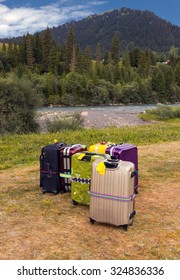 Travel Suitcases In Wilderness Area Heap Of Business Style Bags Dropped In Inappropriate Outdoor Uncivilized Landscape