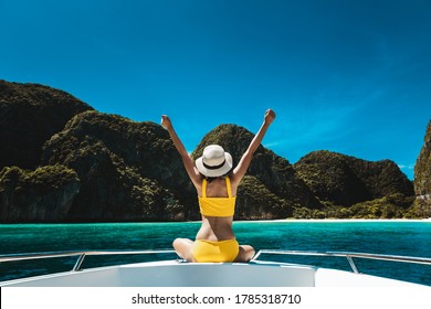 Travel Summer Vacation Concept, Happy Solo Traveler Asian Woman With Bikini And Hat Relax On Boat In Maya Bay Phuket Thailand