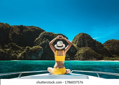 Travel Summer Vacation Concept, Happy Solo Traveler Asian Woman With Bikini And Hat Relax On Boat In Maya Bay Phuket Thailand