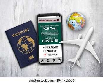 A Travel Theme With Generic Passport And A Smartphone App That Shows Negative PCR Test Result For Covid-19.