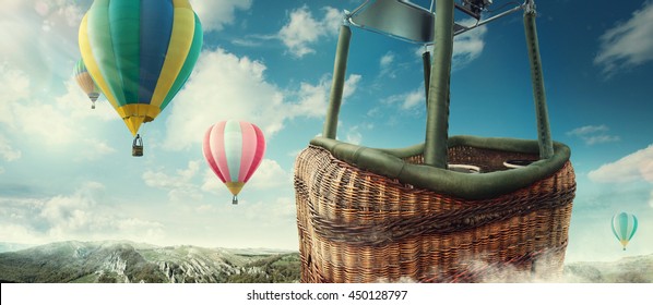 Travel and Tourism. Colorful hot-air balloons flying over the mountain. Close view on basket