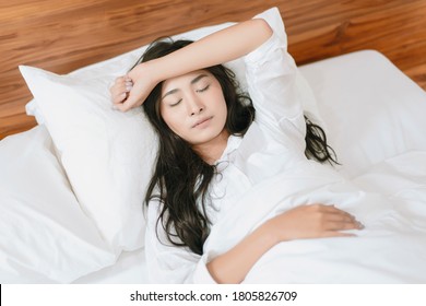 Travel Tourism Concept Of Asian Beautiful Woman Resting In Bed At Hotel Room Yawning Falling Sleeping Comfortably Relaxing Feeling Sick Having Nightmare On Holiday Vacation Accommodation Taking Break 