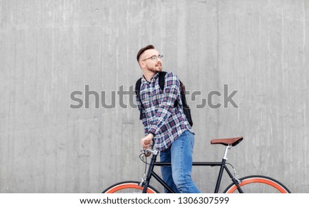 Image, Stock Photo Young man with bicycle in the sea