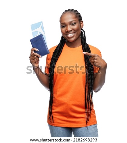 travel, tourism and people concept - happy young woman with passport and air ticket over white background