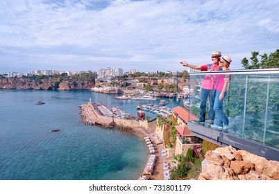 Travel and tourism. Senior family couple enjoying old town harbor view. - Powered by Shutterstock