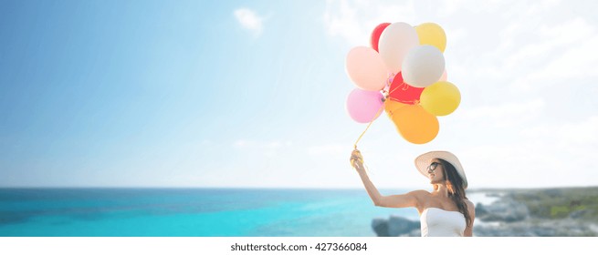 travel, tourism, summer, holidays and people concept - smiling young woman wearing sunglasses with balloons over exotic tropical beach and sea background - Powered by Shutterstock