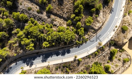 travel and transportation concept - aerial view of beautiful mountain road