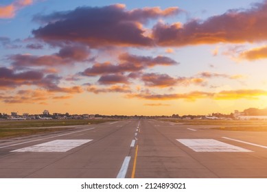 Travel and transportation concept. Empty airplane runway with dramatic sunset light - Powered by Shutterstock