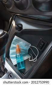 Travel And Vacations Concept, Medical Mask, Hand Sanitizer Spray Placed On Console Inside The Car, Preparation Of Portable Disinfecting Alcohol Spray, Prevention Of Covid-19, Health Care, New Normal.