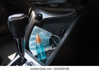 Travel And Vacations Concept, Medical Mask, Hand Sanitizer Spray Placed On Console Inside The Car, Preparation Of Portable Disinfecting Alcohol Spray, Prevention Of Covid-19, Health Care, New Normal.