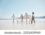 Travel, walking and big family holding hands at the beach on vacation, holiday or adventure together. Bonding, fun and children with parents and grandparents by ocean for fresh air on a weekend trip.
