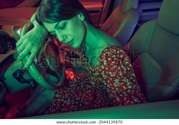 Travel woman resting in car\
at night