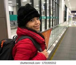 Travel Woman With Trolley Bag On Priority Lane Of The Airport.
