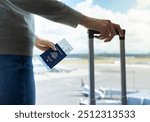 Traveler at airport, US Passport holder traveling by plane