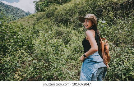 Traveler Asian Woman With Backpack Relaxing And Enjoying Travel Hiking In Mountain And Forest During Vacation