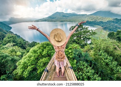 Traveler with backpack and arms up enjoying freedom 