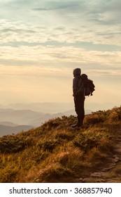 Traveler with backpack and mountain panorama - Shutterstock ID 368857940