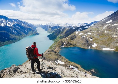 Traveler with backpack and mountain panorama. Norway - Powered by Shutterstock