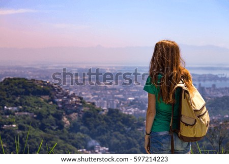 traveler girl with a backpack on the background Rio de Janeiro. Brazil
