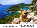 Traveler girl enjoying landscape from Porto Timoni Viewpoint in Corfu, Greece